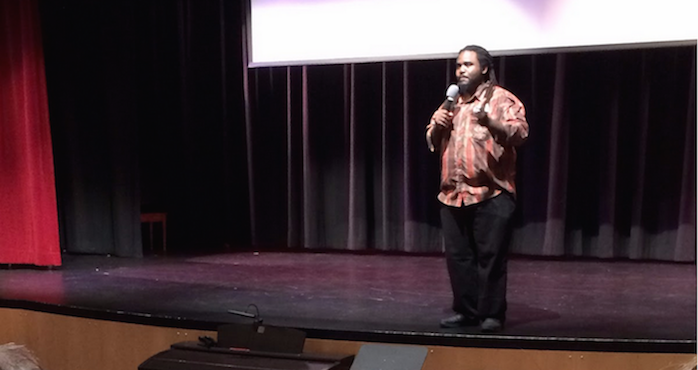 Students listen as Ashanti Branch introduces the film “The Mask You Live In.