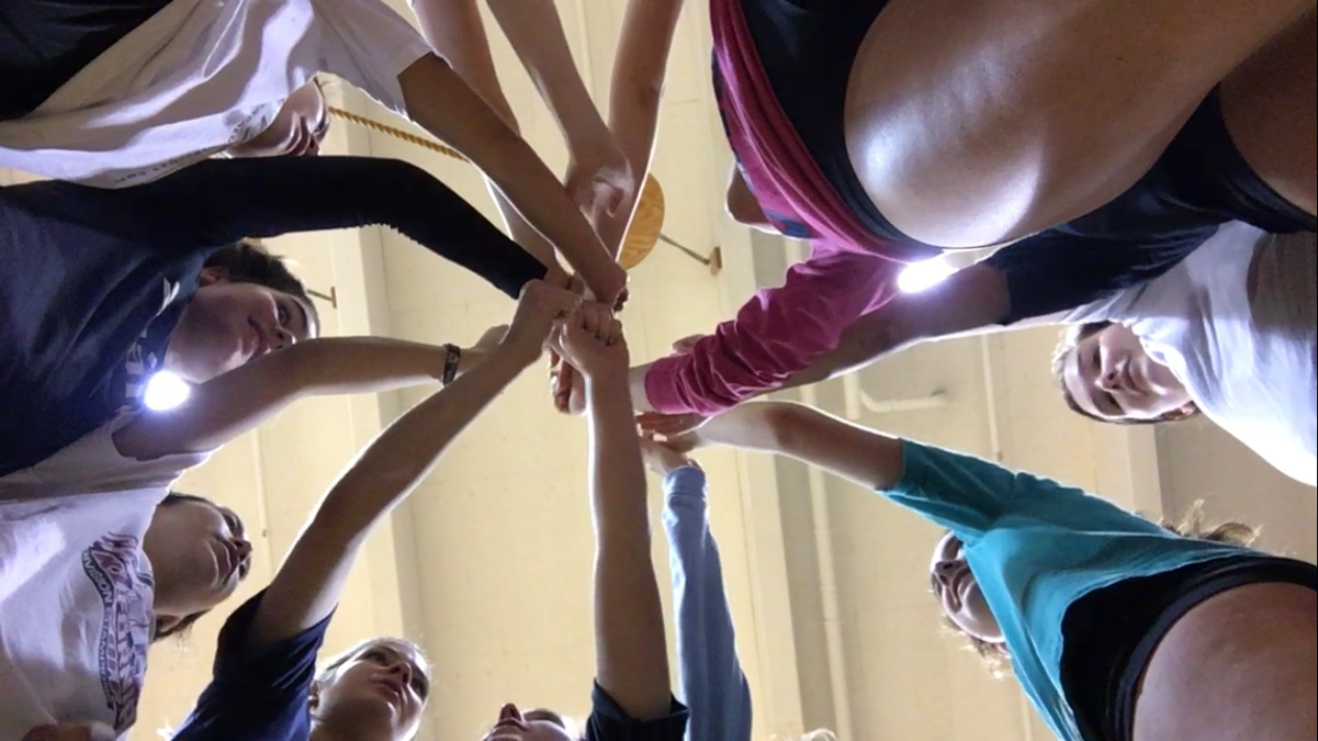 The varsity team cheers at practice before the semi-finals. The girls have been preparing for the playoffs since the first day of the season.