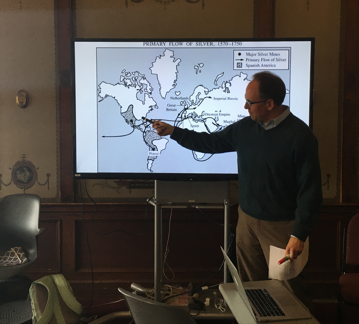 History teacher Michael Stafford further explains the effect of cultural imperialism through a world map. The discussion came after the class presented unit videos and celebrated with snacks.