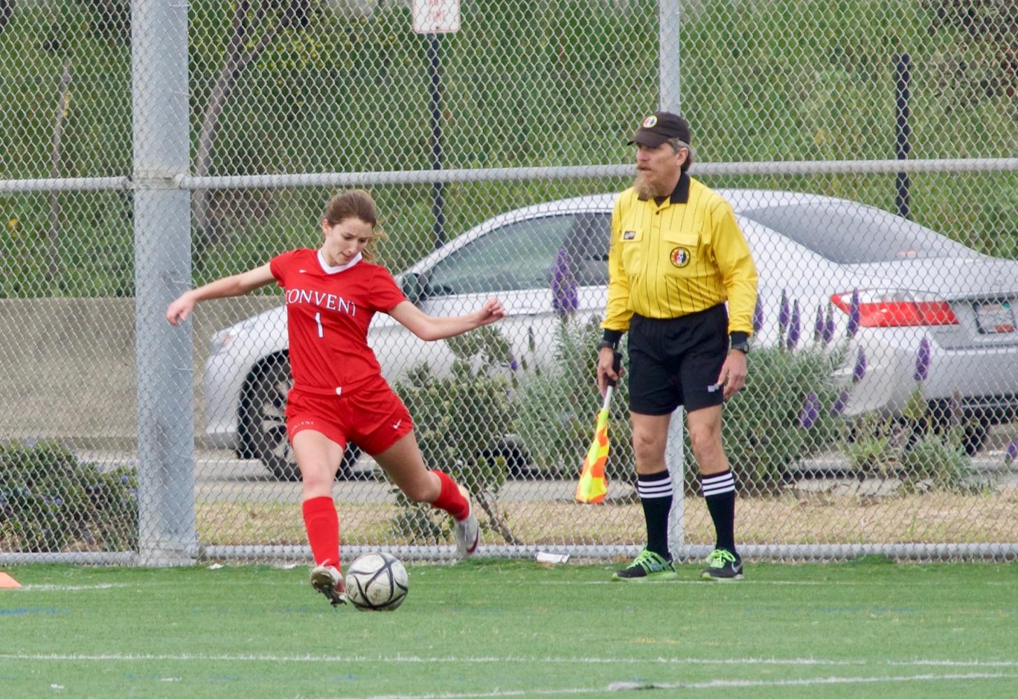 Senior captain Delaney Moslander takes a kick after a foul was called against College Prep during a game in Berkeley on March 23. The game was not a league game and did not contribute to the team’s path to playoffs.
