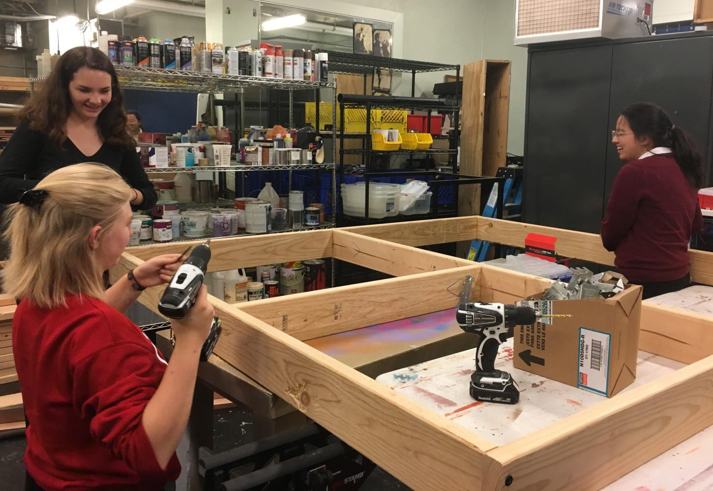 Freshmen Anya Hilpert and Lola Morrell and junior Sydney Marquez work as part of stage crew for the fall production, “The Crucible.” Opening night is Nov. 9, followed by performances on Nov. 10 and 11.