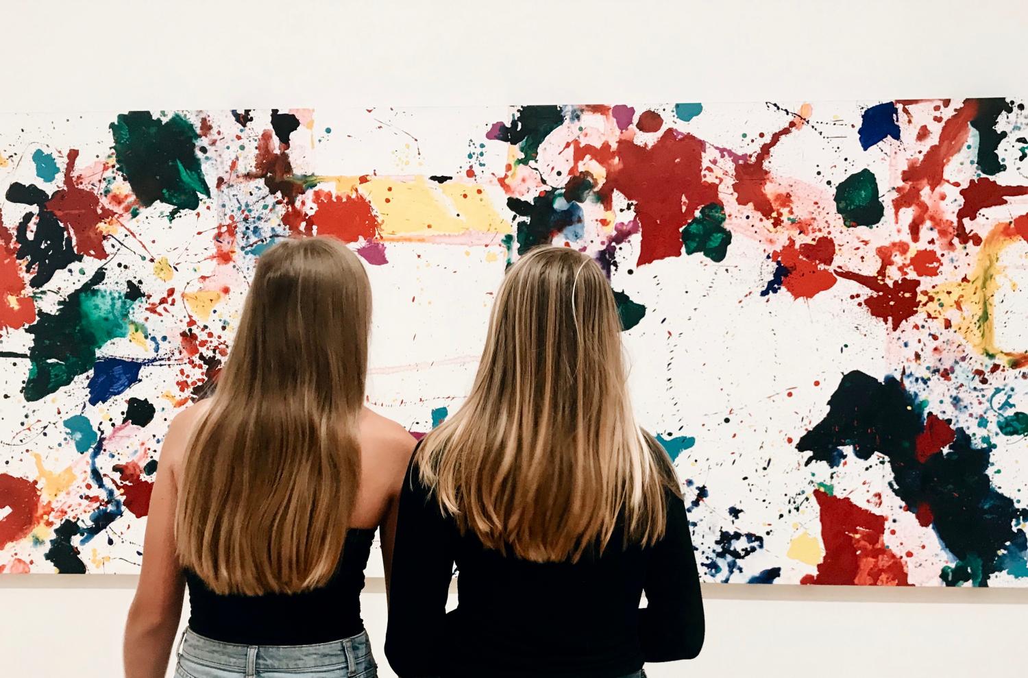 Juniors Abby Anderson and Maggie Walter analyze a work at the San Francisco Museum of Modern Art. The IB students were two of a large group who went to the museum to explore different art pieces and artists.