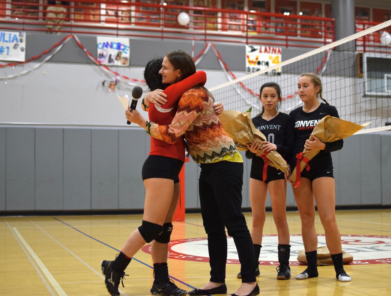 Senior Alayna Wong and Athletic Director Elena De Santis hug after Wong is called up as the first senior recognized of the night. De Santis honored each of the three seniors with short and personal speeches.