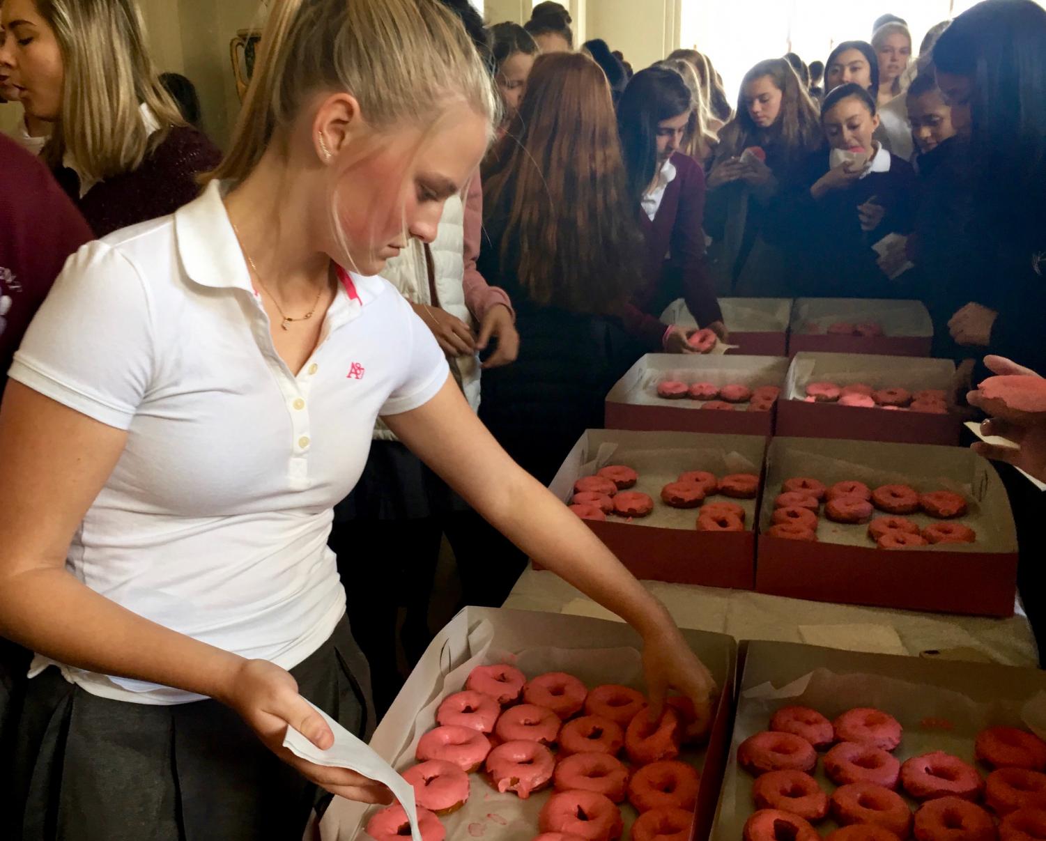 Junior Abby Anderson grabs some goûter after chapel. Goûter is the French word for