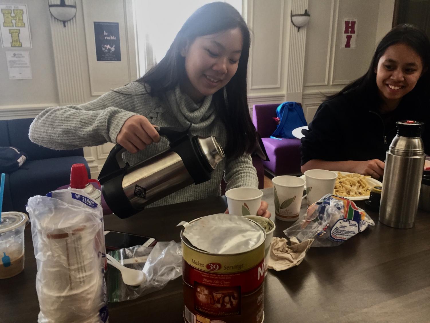 Kelly Chan pours hot chocolate as part of hot chocolate sale. The Service to the Homeless Club worked at the Haight Ashbury Food Program last week where they helped distribute food.