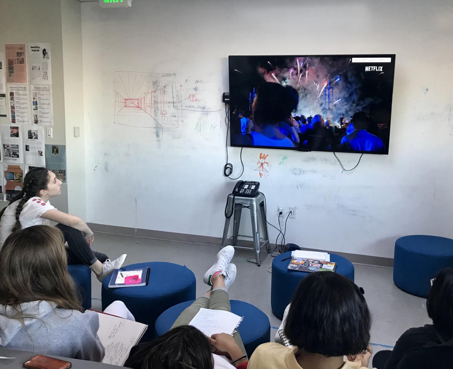 Students watch a Netflix documentary trailer about a Chinese artist using fireworks to create his pieces. The class will have a final project where they must use the inspiration and style from three different artist during the age of contemporary and modern art.