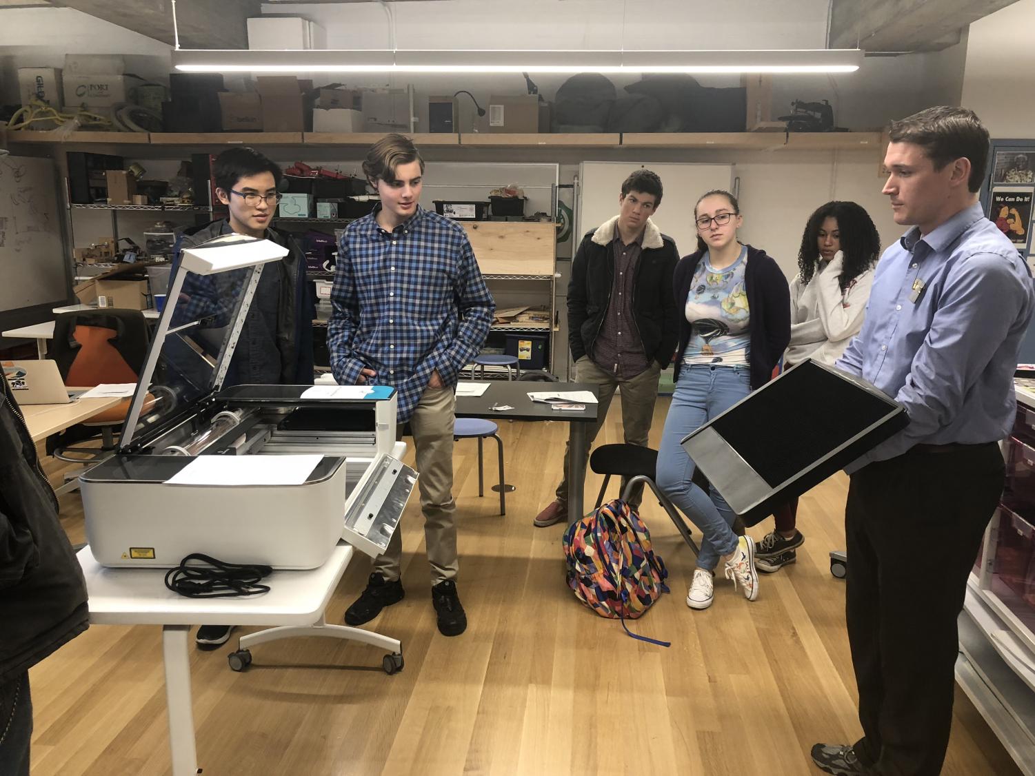 Students gather in Spark Studio for unveil of 3D laser printer. The printer was ordered two years ago and arrived in January.