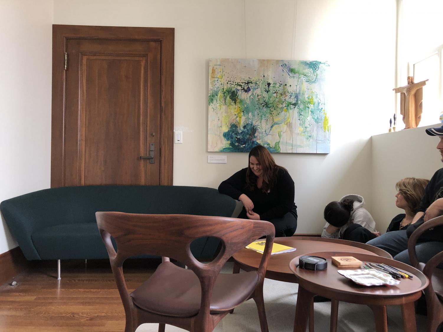 Sophomore Colette Hom crouches in the corner of an office with members of the faculty during the lockdown drill. The couch was moved to block the door, and everyone crouched below windows so they would not be seen.