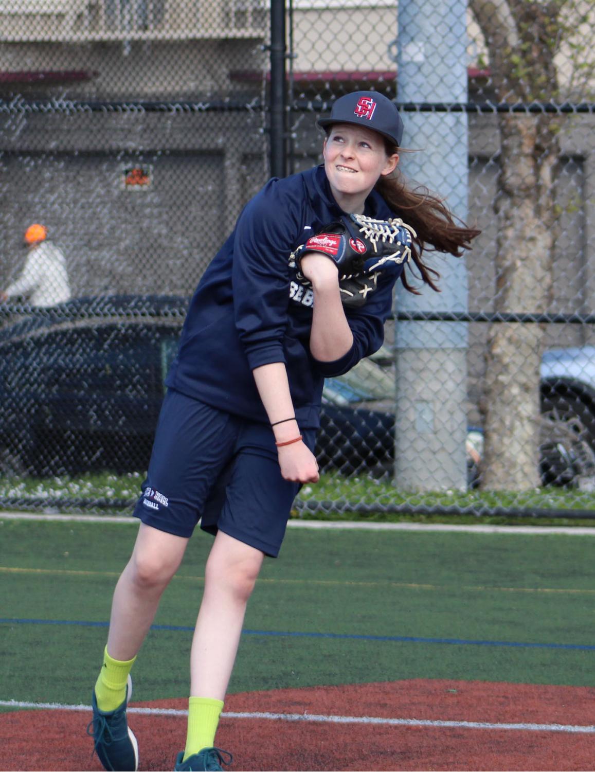 Freshman Cecilia McQuaid throws during practice with the Stuart Hall High School varsity baseball team. The team’s next game is Tuesday, March 27 against the Archbishop Riordan High School Crusaders.