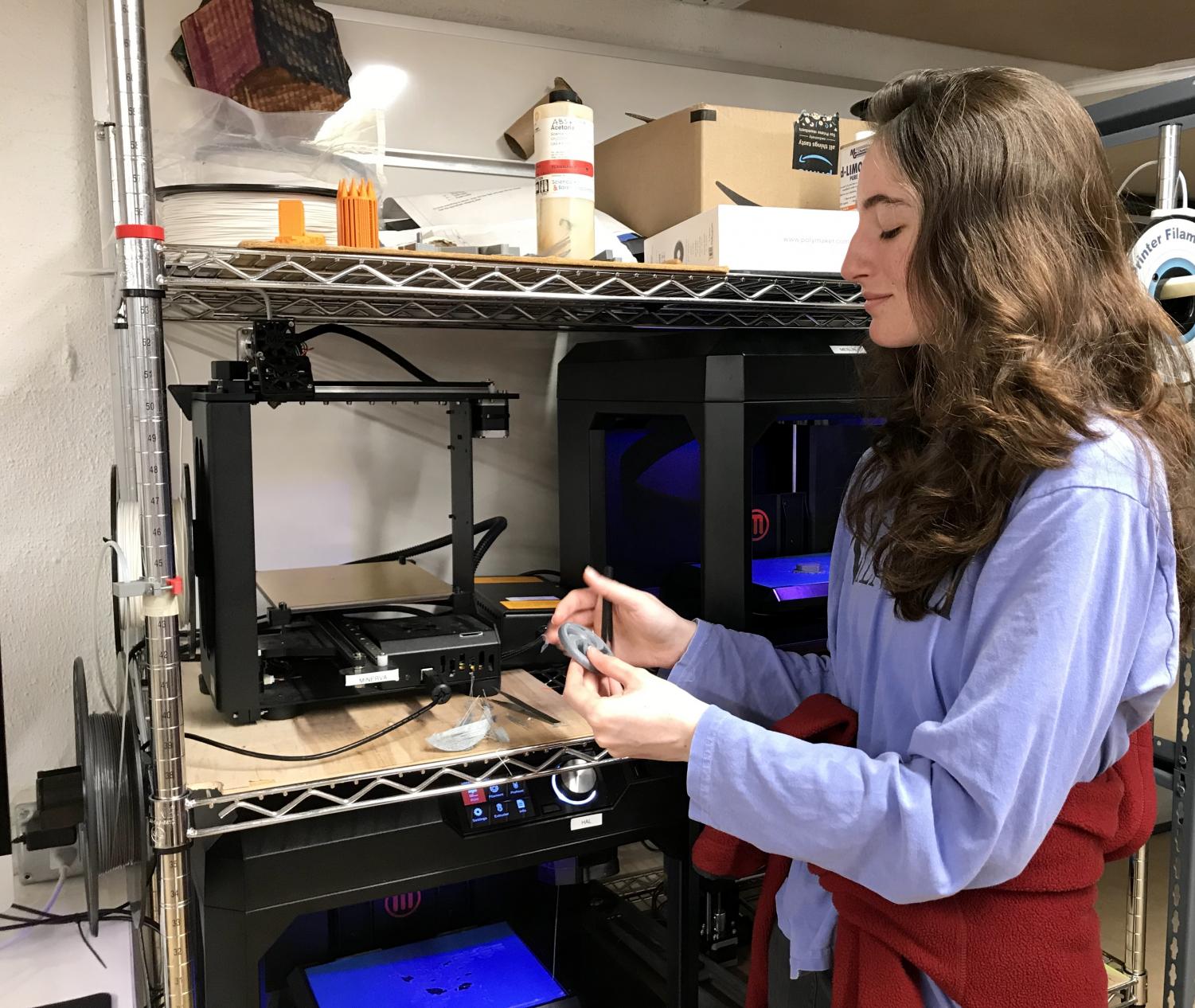 Senior Natalie Lunbeck works with machinery at a club meeting. The Innobotics Club was founded two years ago by Convent graduates.
