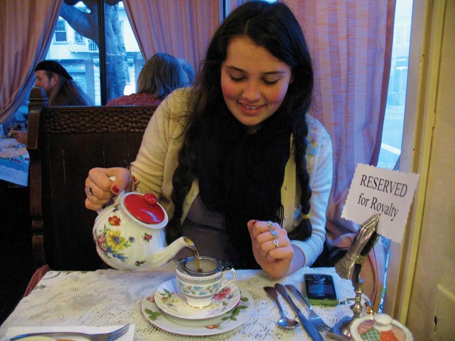 Junior Frankie Incerty pours tea at Lovejoy’s Tea Room. Although the sign says “Reserved for Royalty,” Lovejoys welcomes tea drinkers of all ages — specializing in warm scones and dainty sandwiches with the crusts cut off. ANJALI SHRESTHA | the broadview