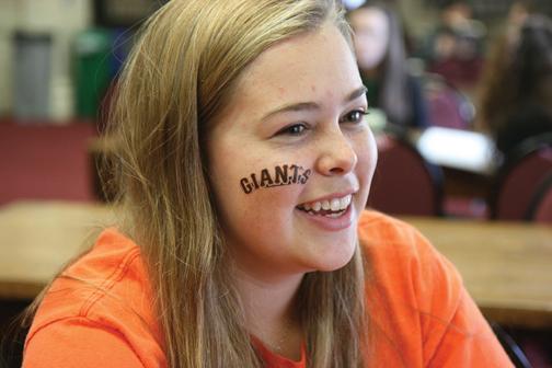 Senior Katie Carlson watches the fourth playoff game in the Center. Carlson posted a YouTube video of herself sobbing after watching the Giants win the pennant. Photo: ZOE NEWCOMB | the broadview