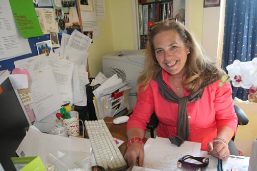 Zoe Newcomb | the broadview.  Celine Curran sits at her desk surrounded by mementos and flowers sent to her for her birthday last weekend. Curran entered CSH as a student in 1969.