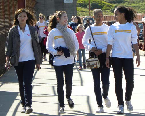   Freshmen Rachel Fung, Christina Braa, Lisa Cameron and Dervla Carey-Jones sport their Walk for Uganda long-sleaved shirts. REBECCA LEE | The Broadview