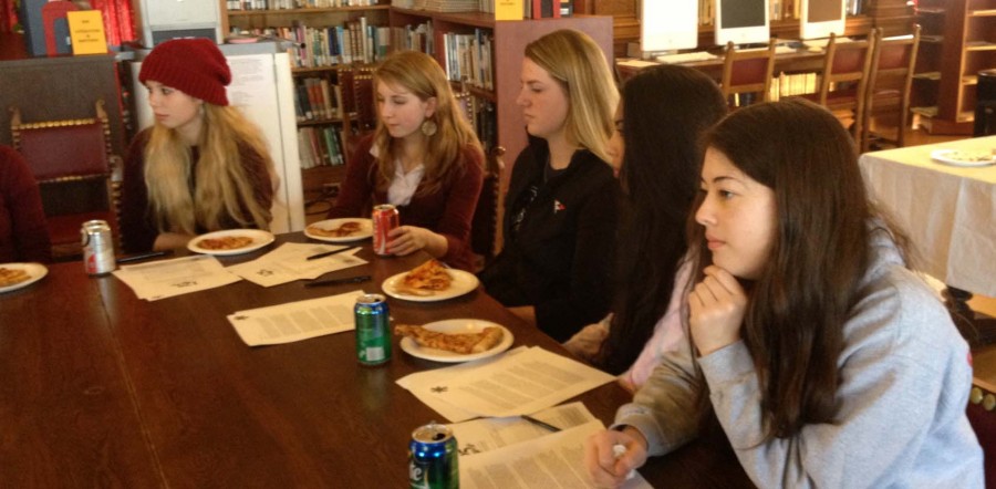 Freshman Julia Praeger, juniors Francesca Dana, Alyssa Viscio and senior Gina Domergue (left to right), interview a candidate for head of school. Four candidates were interviewed over the course of the month.