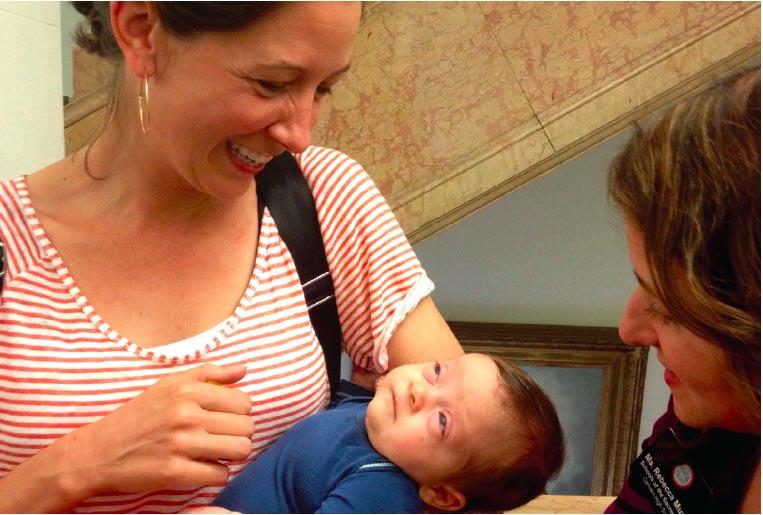 Madeleine Ainslie/The Broadview Rachel McIntire chats with fellow new mother Rebecca Munda during her visit to school with her daughter last week. Baby Isla’s first visit to school attracted a slew of potential sitters.