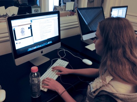 Senior Julia Nemy takes notes while she watches Science Department Chair Ray Cintis video on the oral cavity. The video is one of two videos Cinti made to introduce the unit on the digestive system. 