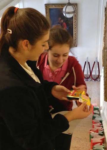 Sophomores Kristin Weinmen and Jessica Sushansky discover their Secret Santa gifts. Secret Santas will reveal themselves today.