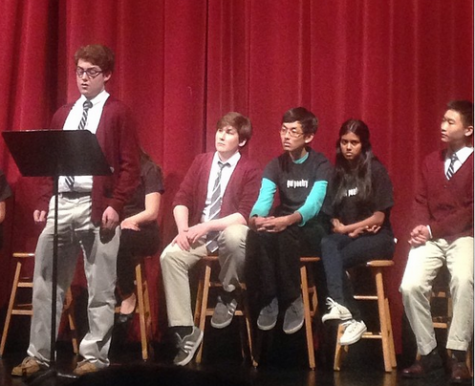 Senior Thomas Egan recites an original poem at the annual Poetry Festival. The Festivals theme this year is Voice, and included performances by the SHHS a cappella group.