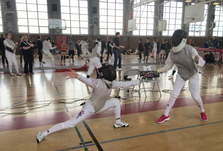 Sophomore Bea Gee lunges at her opponent during a fencing match. Rena Gee| with permission