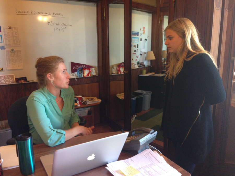 Senior Sabine Kelly talks to Interim College Counselor Joy Phillips about getting off the wait list at her top choice for college. Students who are wait listed should put a deposit down at another preferred college or university by tomorrow but also keep in contact with their rep for their top choice.