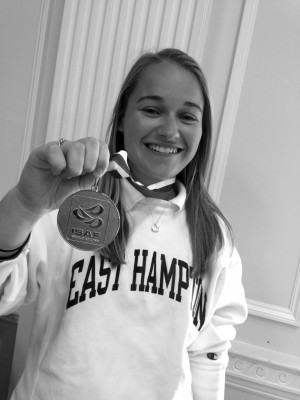 Senior Paige Dunlevy shows off her gold-medal from the International Sailing Federation Team-Racing World Championships. Dunlevy acted as replacement for a team member who was not eligible to compete.