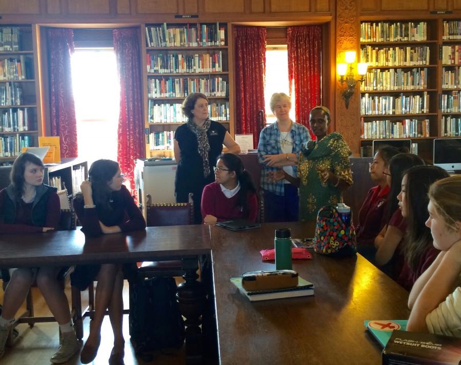 Tracy Sena, who visited Sacred Heart schools in Uganda with other Network teachers in 2012 (left to right), Sister Irene Cullen, RSCJ, and Sister Noellina Namusisi, RSCJ, speak to freshmen about girls education and contribution from Walk for Uganda.