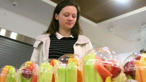 Senior Jennifer Quillen picks out a fruit cup from the cafeteria. Fruit is an essential part of a healthy breakfast but should be accompanied by protein and grains. the old saying breakfast is the most important meal of the day is still relevant, but is often undermined by rushing to school in the morning. In a time crunch, choose a grab-n-go, low-fat option like a protein bar.