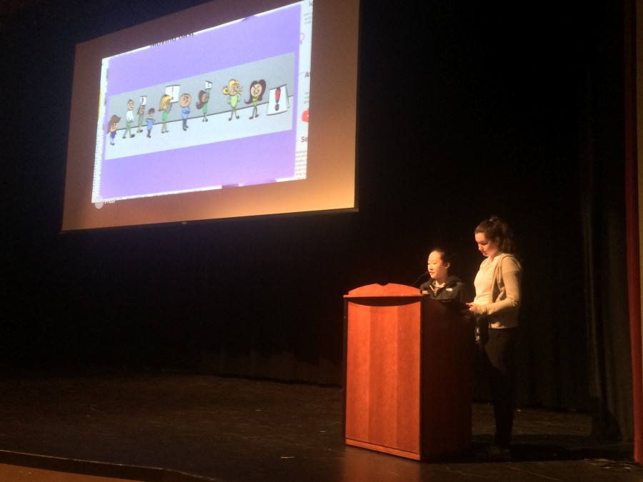 Editors Liana Lum and Kendra Harvey show a cartoon published in The Broadview as part of their press freedom and first amendment rights presentation today. Lum and Harvey asked students to name the first amendment rights and winners received (amend)mints.