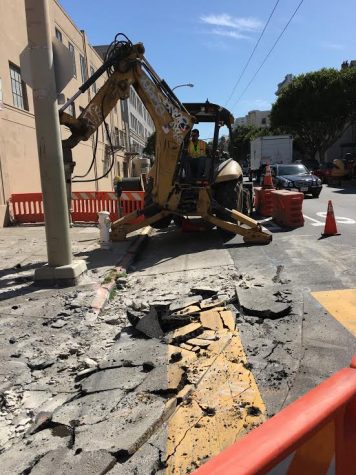 A City construction worker operates an excavator to access a pipeline yesterday. The project is to fix the sewage pipelines a few blocks from campus.