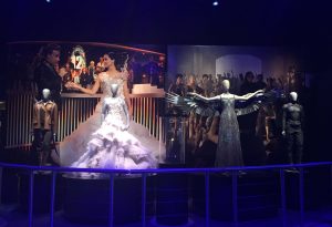 Katniss Everdeen is highlighted through a series of costumes in the final room of The Hunger Games: The Exhibition. Six exhibit rooms showcase some of her most popular outfits.