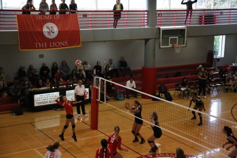 Sophomore Avery Van Natta   spikes the ball during the varsity opening game against Waldorf last Friday. The team lost the match 1-3.