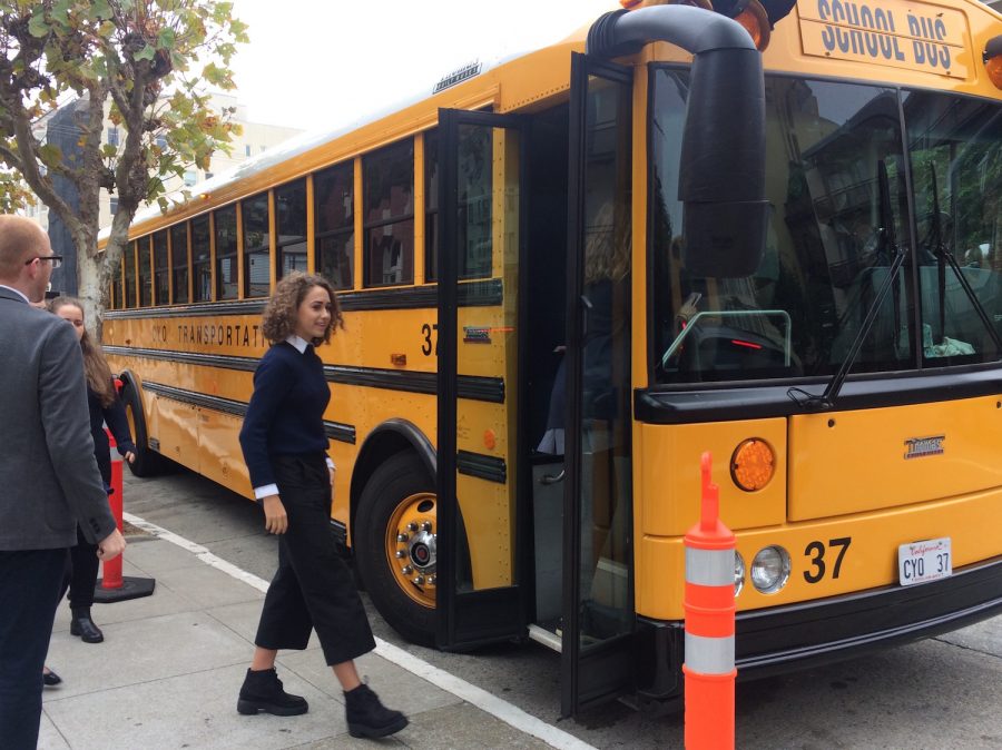 Senior Elisa Ternynck boards the bus to Cathedral of Saint Mary of the Assumption, the location of the annual Mass of the Holy Spirit. Bystanders outside of the church watched the Senior Class as they proceeded into the church last as per tradition.