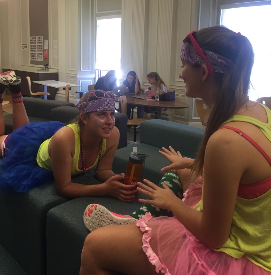 Seniors Katie Newbold and Delaney Moslander wear coordinating outfits for today's color day. The two handed out colorful bead necklaces to less eager participants.