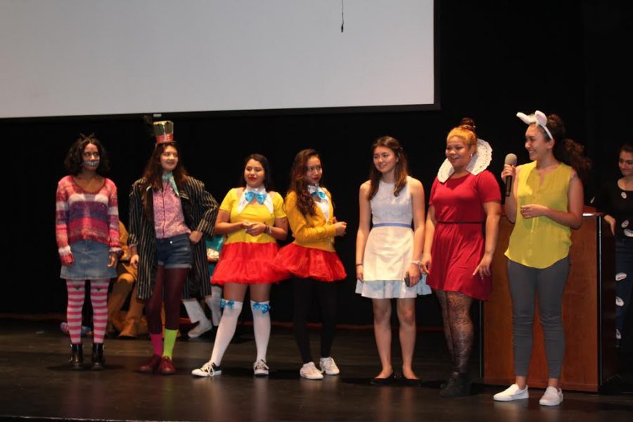 Freshmen dressed as “Alice’s Adventures in Wonderland” and explaining their costumes. The group, which won first place, had been coordinating individual costumes for weeks.
