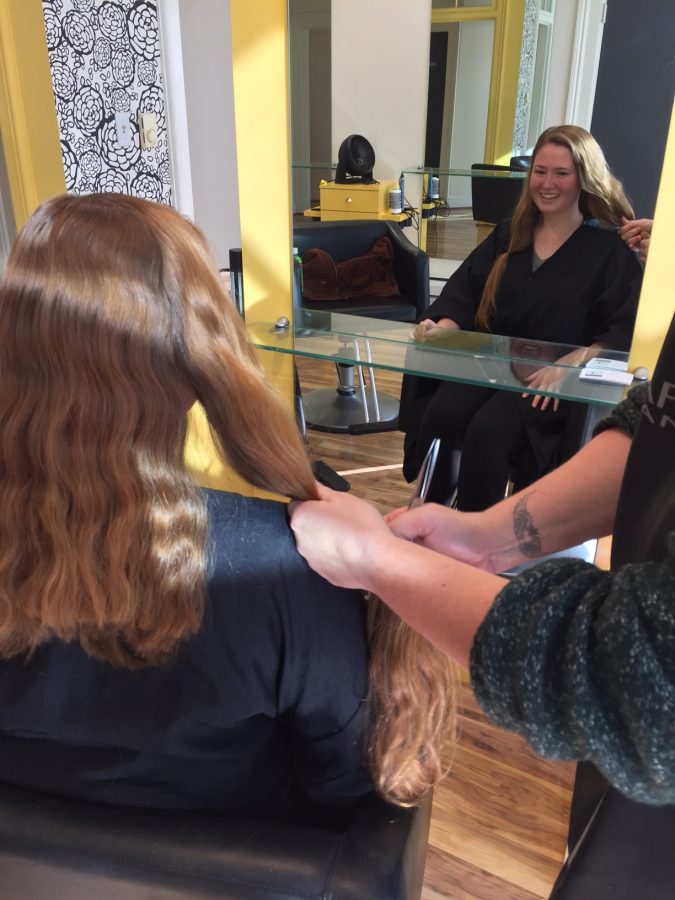 Junior Grace Ainslie gets her hair cut at ESolan in order to donate her to Locks of Love. This was Ainslies second time donating hair to the non-profit that makes hairpieces for children with hair loss.
