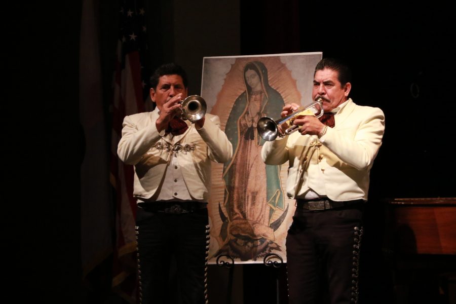 Mariachi trumpet players perform at the co-ed assembly to honor Our Lady Guadalupe in the Syufy Theater. The assembly brought attention to a Catholic Mexican celebration that initiated Mexico’s conversion to Christianity in 1531.