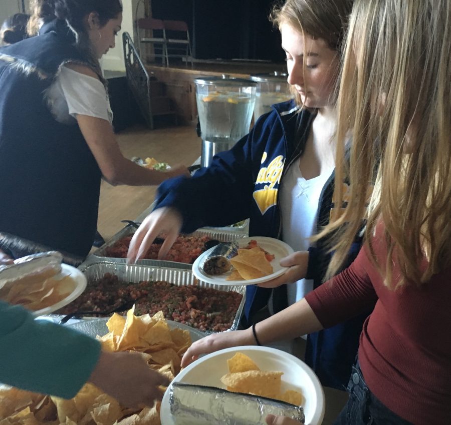 Sophomores+Abby+Anderson%2C+Sophie+Egan+and+Sofia+Pirri+help+themselves+to+burritos%2C+chips+and+salsa+before+today%E2%80%99s+meeting.+The+meeting+went+through+lunch%2C+and+sophomores+were+invited+to+ask+any+questions+they+had+about+their+upcoming+trip.+