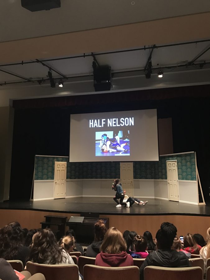 During the end of the week assembly seniors Masha Kozlova and Olivia Hoekendijk demonstrate a wrestling move to the school. Once a week during assembly, seniors do a presentation in front of the school describing something that interests them or something that makes them different.