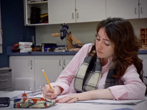 Junior Natalie Lunbeck takes notes during Chris Person-Rennell's Algebra 2 class. Students in this class are currently learning about logarithms and the compound interest formula.