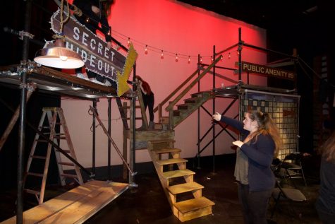 Stage manager Maya Shur helps to switch sets during intermission. The tech crew has to hurry between scenes and acts to rotate the props to set the stage for another location.