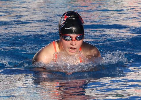Anna Doggett swims the breaststroke in the March 2 pre-season swim meet. The swim team gained almost 20 new members this season.