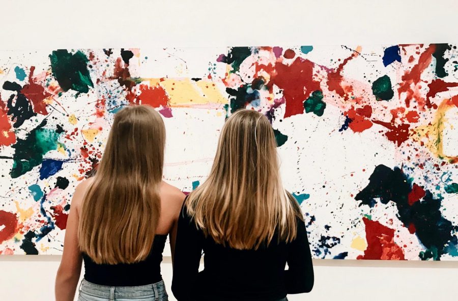 Juniors Abby Anderson and Maggie Walter analyze a work at the San Francisco Museum of Modern Art. The IB students were two of a large group who went to the museum to explore different art pieces and artists. 