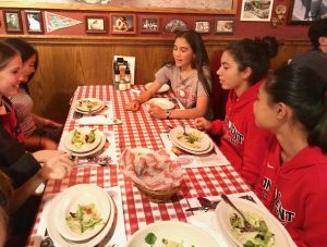 Freshmen part of the cross-country team eat dinner at Buca de Beppo in preparation for their race at the Mt. SAC Invitational tomorrow. Runners left school after F Period and bused to Los Angeles.