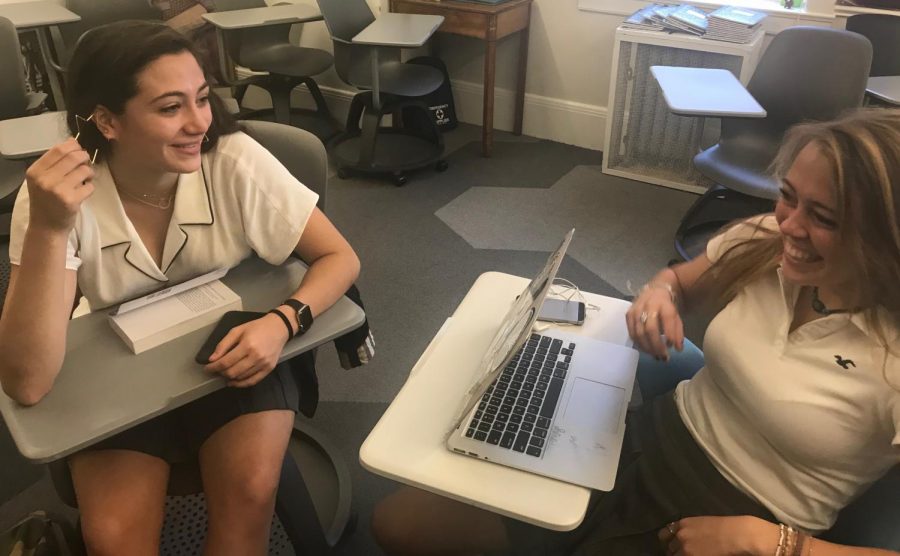 Juniors Sofia Pirri and Elizabeth Worthington discuss the upcoming wrestling season. Pirri was among the first girls to join the wrestling team last year when the team first became co-ed.