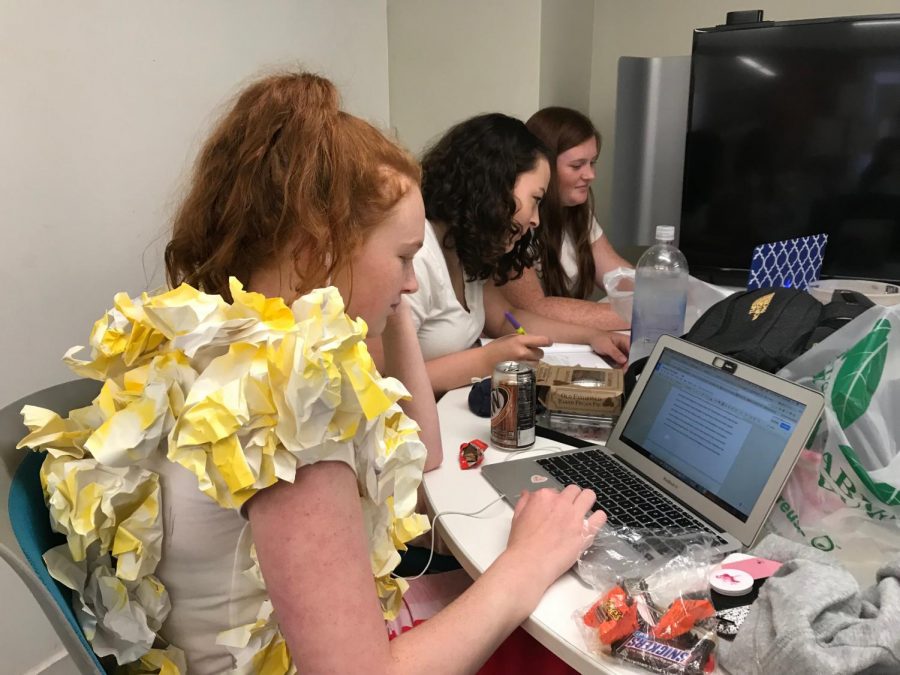 Sophomores Zoe Forbes, Dena Silver and Lauren Tulley work on English in the workspace on the second floor. The girls presented their costumes during the Halloween assembly and won best homemade costume. 
