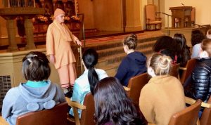 Swami Vendananda addresses sophomore students during their visit to the Vedanta Society as part of the Hinduism unit in their World Religions Text and Tradition Theology class. In addition to this trip, sophomores have read ancient Hindu texts and practiced yoga during this unit.