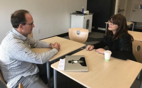 Sophomore history teacher Michael Stafford meets with Alina Aeby, mother of sophomore Sophia Aeby. Parent Teacher Conferences took place on the Stuart Hall campus.