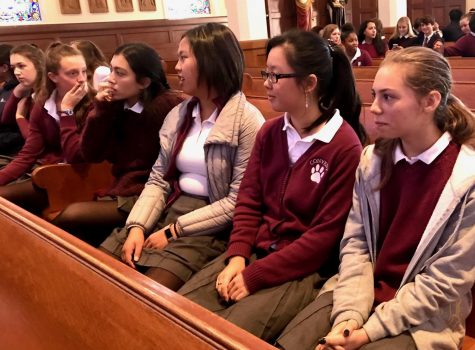 Sophomores Zoe Hinks, Michelle Wang and Abby Widjanarko wait for Mass to begin. The Mass was coed, so students from the Broadway Campus had to wait for students coming from the Pine-Octavia campus arrive. 