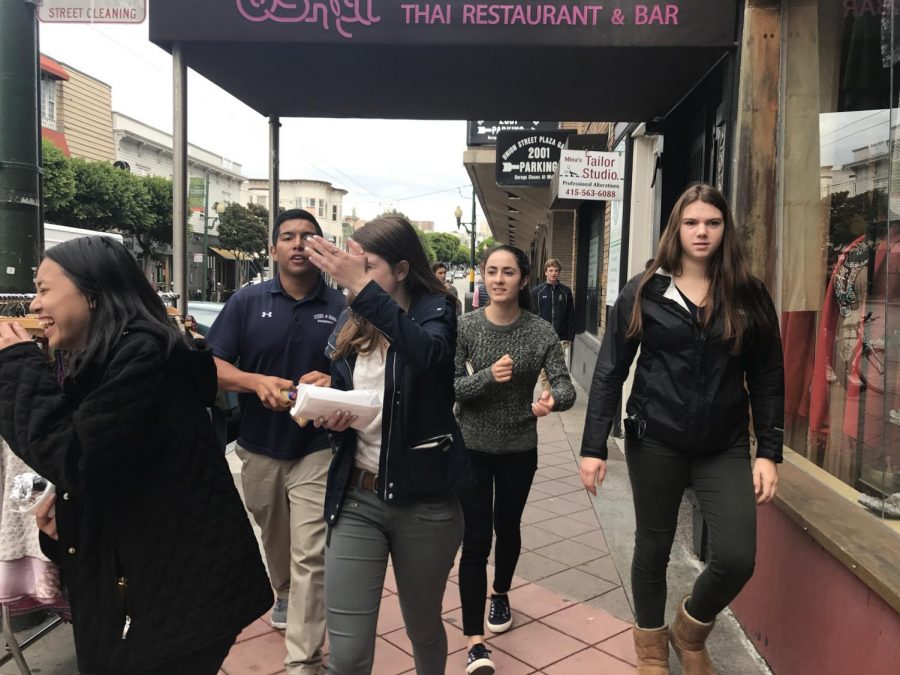 Some+students+wear+jackets+in+anticipation+of+rain+as+they+walk+on+Union+street.+The+class+went+to+La+Canasta+Taqueria+during+their+Spanish+period.